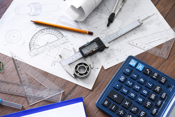 Engineering supplies on wooden table closeup