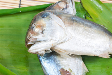 mackerel fish put on banana leaf

