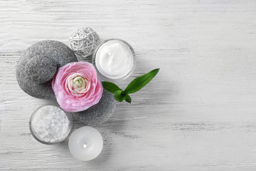 Composition of spa treatment on white wooden background