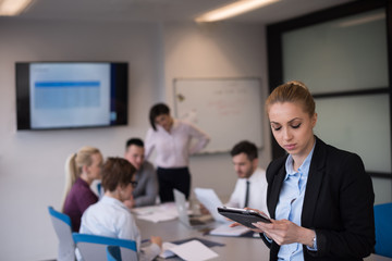 business woman working on tablet at meeting room