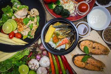 Pork with grilled salmon, salad, vegetables and spices to cook o