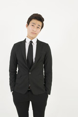 Asian young man in a black suit