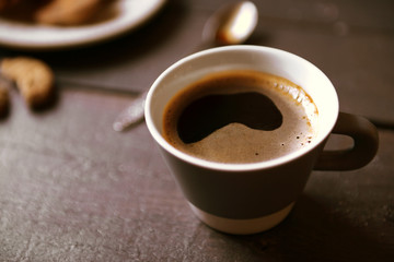 Cup of coffee on wooden table