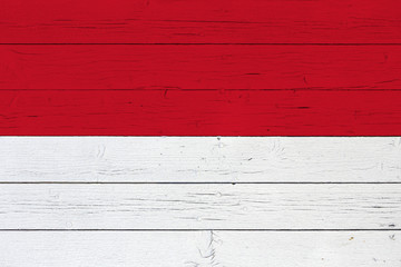 Flag of Monaco on wooden background