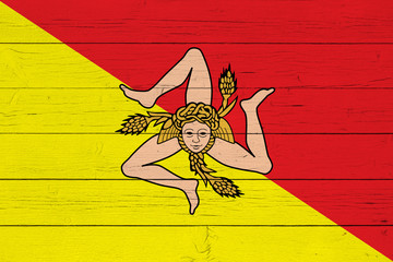 Flag of Sicily on wooden background