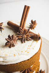 Cake with cream on the white wooden background. Shallow depth of field.