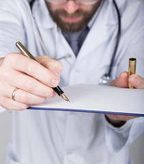 close-up hands and pen, the doctor signs a handle documents. Doctor writes medical history. write a prescription patient data history