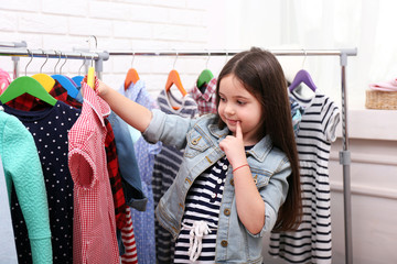 Little girl trying on a new dress