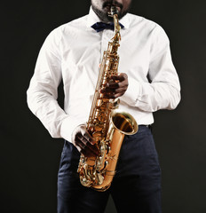 African American jazz musician playing the saxophone, closeup