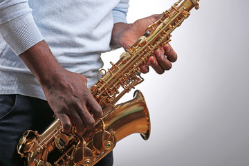 African American jazz musician playing the saxophone, closeup