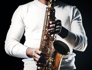 African American jazz musician playing the saxophone, closeup