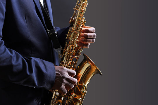 African American jazz musician playing the saxophone, closeup