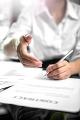 Business offering a handshake and contract