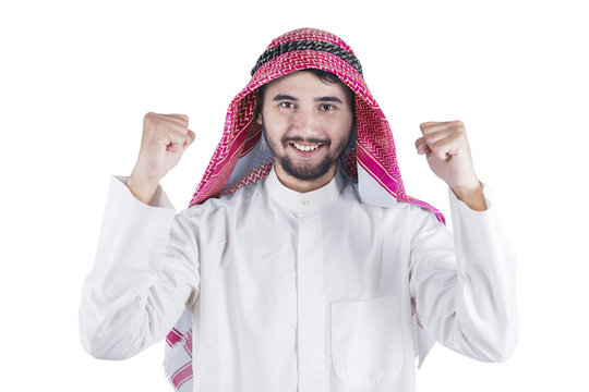 Happy Arabic man expressing his success