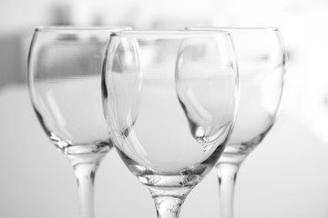 Wineglasses on blurred interior background