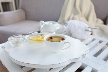 Tea set on a white wooden tray