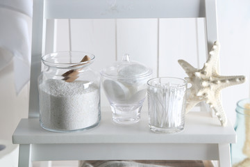 Bath accessories on wooden wall background