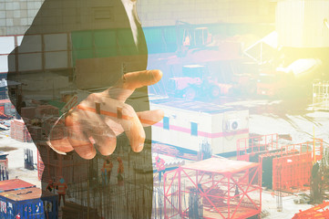 Double exposure of Businessman and Construction site