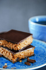 Tasty homemade cakes with chocolate on dark background, close up