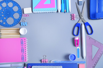 Set of stationery on grey table, top view