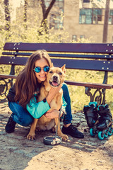 Female with dog in a park.