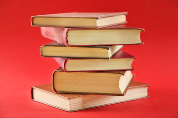 Stack of  books on red background