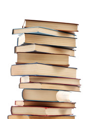 Stack of new and old books isolated on white