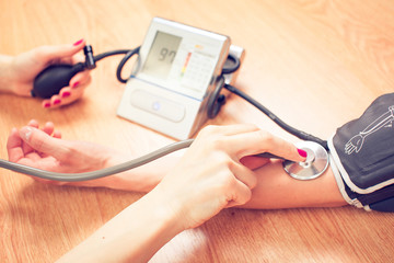 Young female doctor or nurse taking  patients