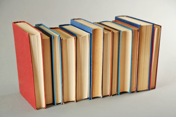 Book collection on grey background