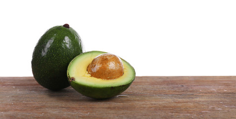Fresh avocado on wooden table