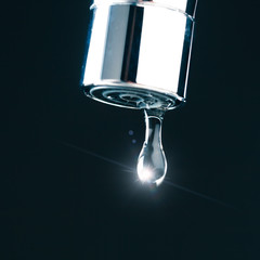 water drop on faucet, macro view