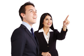 Female coworker pointing while male coworker is looking