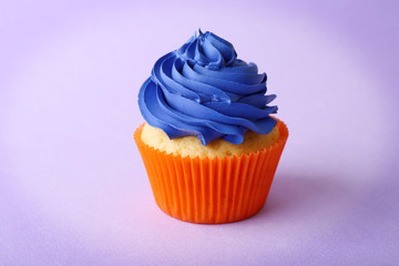 Birthday cupcake on purple background