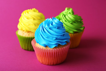 Birthday cupcakes on pink background