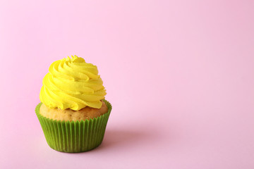 Birthday cupcake on light pink background