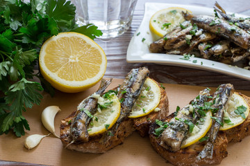 Snack from sandwiches with sardines.
