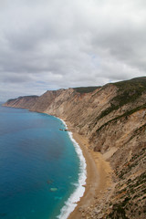 Steep cliffs and lonely beach (Platia Ammos), the coastline of the Greek Ionian Island Kefalonia