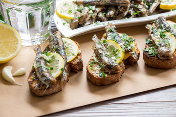 Snack from sandwiches with sardines.