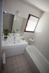 Bright space - a silver tap in a white bathroom