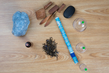Fototapeta na wymiar Acupuncture needles, moxa sticks, macerated oil, herbs TCM