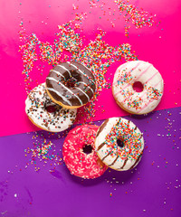 Donuts on color background.