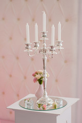 Antique candlestick with wedding bouquet. 