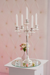 Antique candlestick with wedding bouquet. 