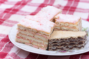 Cake with cookies and strawberries served on a plate