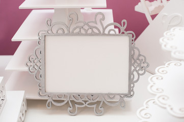 Vintage white frame on a table and place for text