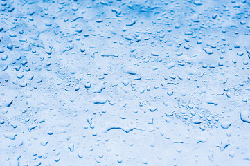 blue water drops texture on the glass background