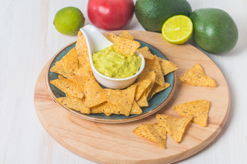 Green Guacamole with nachos and avocado