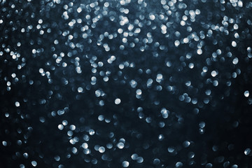 Dark bokeh background, abstract seamless backdrop, navy blue color © juliasudnitskaya