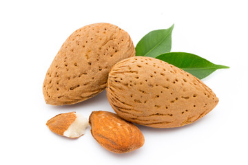 Almonds with leaves isolated on white background