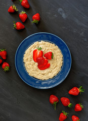 Oatmeal porridge with strawberries